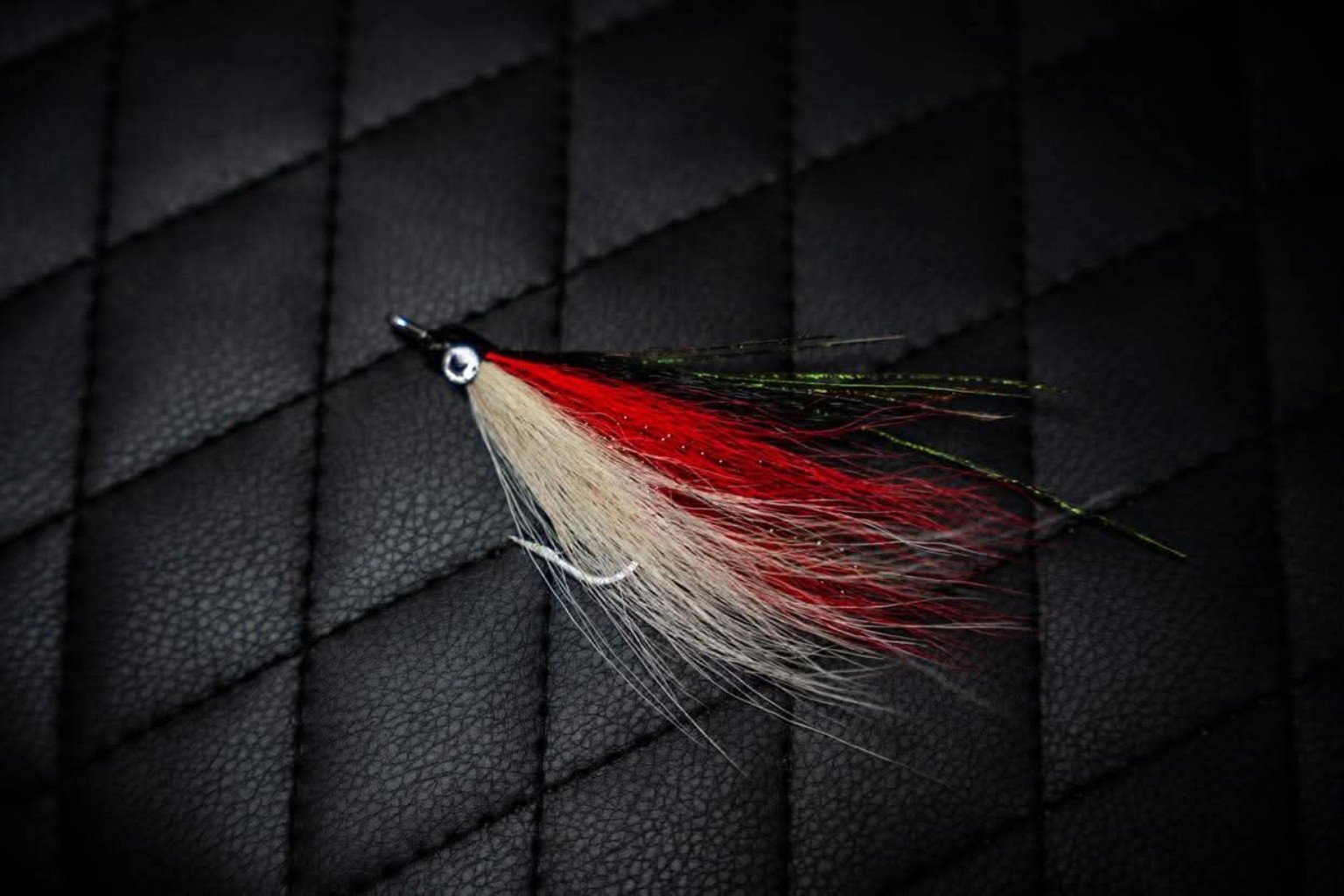 Red white and black handmade bucktail lure